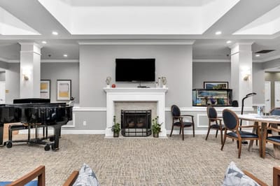 Common area with seating, piano, and fireplace