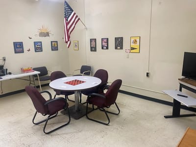 Bright common area with chairs and chessboard