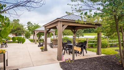 Outdoor seating pavilion in a landscaped area