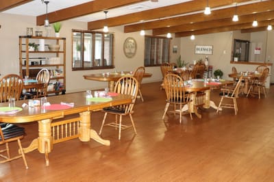 Interior view of a dining area with wooden tables