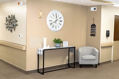 Interior hallway with clock and decor items