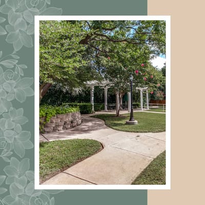 A garden path with greenery and seating areas