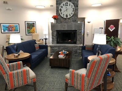 Comfortable common area with seating and fireplace