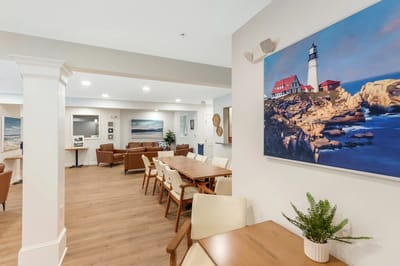 Bright common area with comfortable seating and artwork