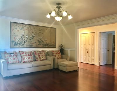 Bright interior living space with a couch and art