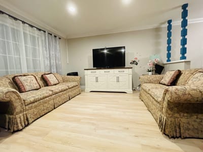 Cozy common area with sofas and a TV