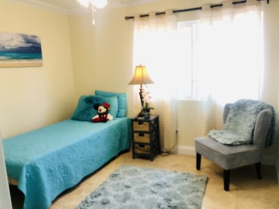 Cozy resident room with blue bedding and decor