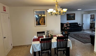 Dining area with a table and chairs in a common room