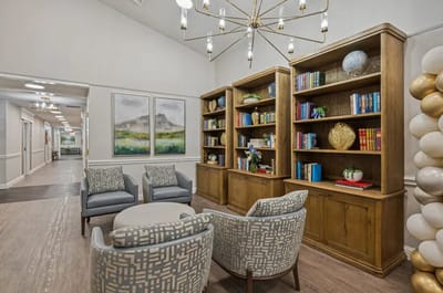 Common area with bookshelves and seating