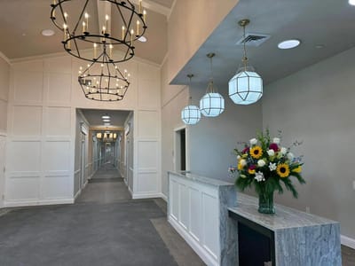 Bright interior view of the facility lobby with flowers