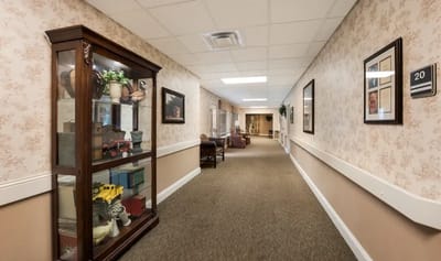 Wide view of a hallway with furnishings and decorations