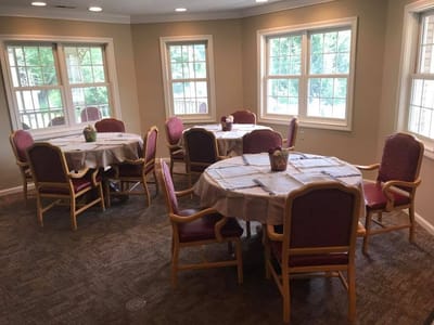 Dining area with tables and chairs in a well-lit room