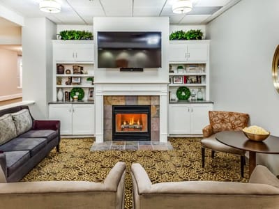Cozy common area with seating and a fireplace