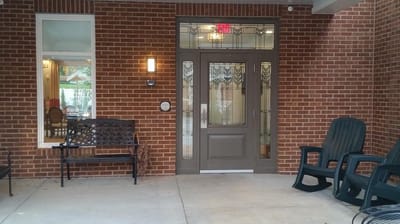 Entrance of a building with a rich brick facade