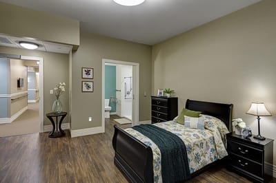 Private resident room with a bed and bathroom
