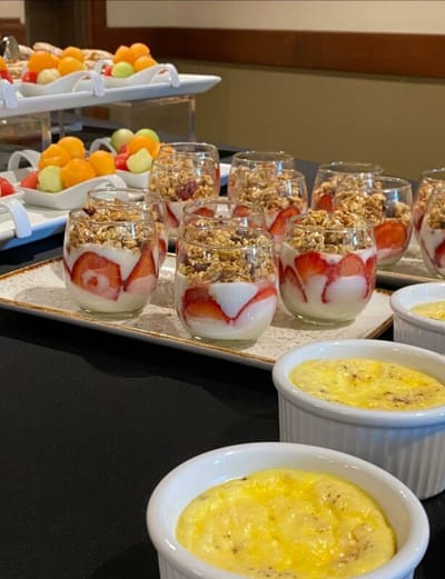 A selection of dessert cups and fruit platters