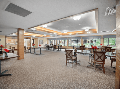 Dining area with tables set for residents