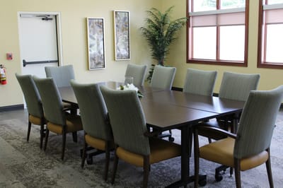 Meeting room with a long table and chairs