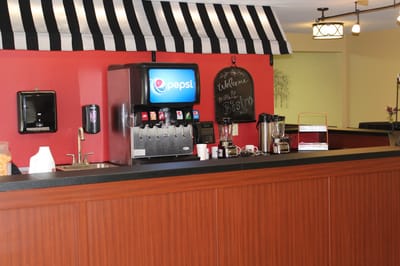 Inside view of a bistro area with beverage dispenser