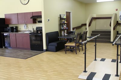 Interior view of a common area with kitchen and seating