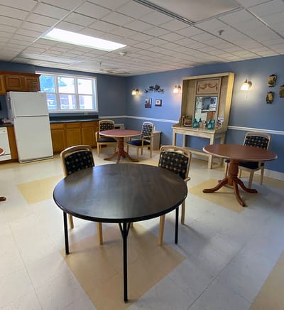 Bright common area with tables and chairs