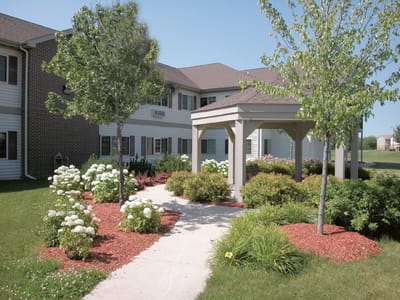 Landscaped pathway leading to building entrance