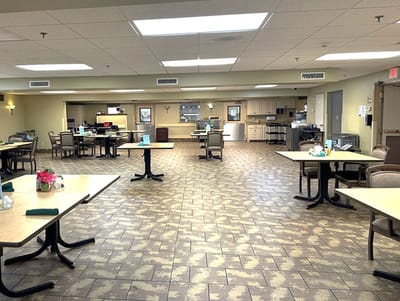 Dining room setup with tables and chairs