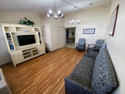 Common area with seating and television