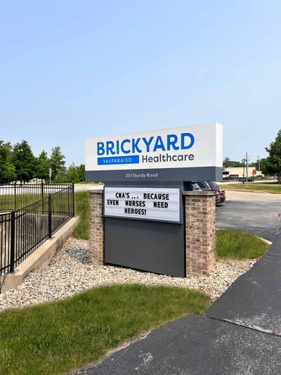 Facility sign outside with a message for nurses