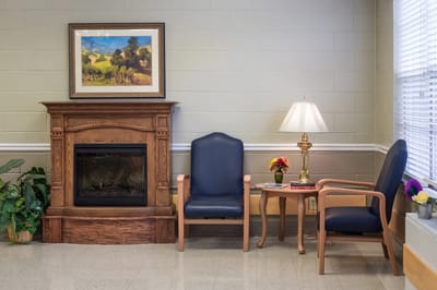 Cozy lounge area with fireplace and seating