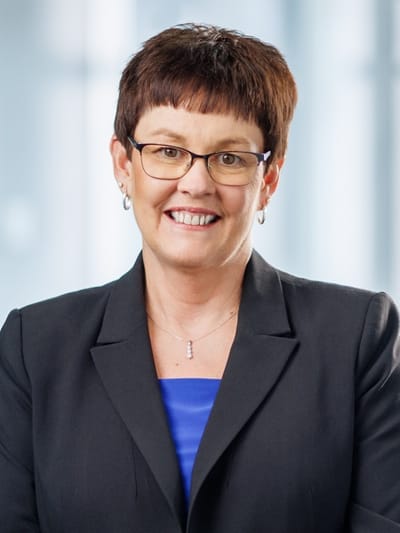 Professional woman in a business suit smiling