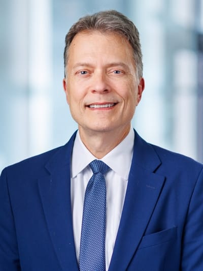 Portrait of a man in a suit smiling