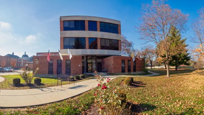 Exterior view of Abbey Senior Health building with landscaped garden