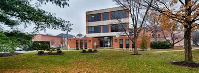 Exterior view of Abbey Senior Health building on a rainy day