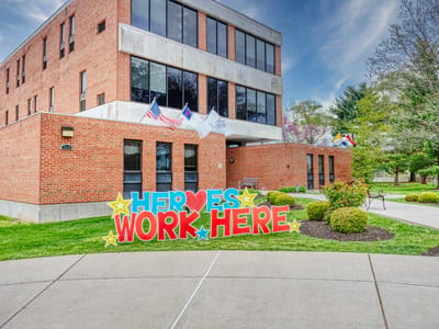 Exterior view of the facility with a colorful sign
