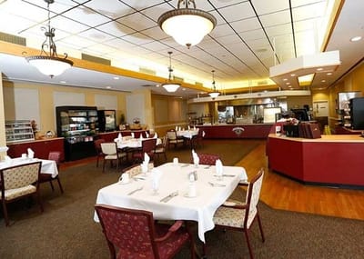 Dining area with neatly set tables and cozy decor