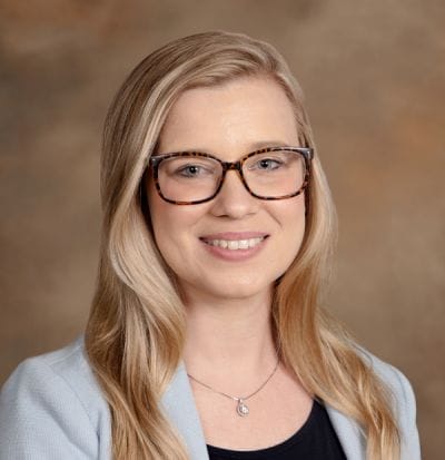 Dove Healthcare – West Eau Claire, Nursing Home in Eau Claire, WI — Professional headshot of a smiling woman with glasses