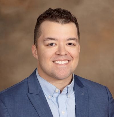 Dove Healthcare – Superior, Nursing Home in Superior, WI — Professional headshot of a smiling young man