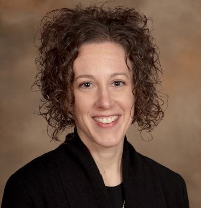 Dove Healthcare – West Eau Claire, Nursing Home in Eau Claire, WI — Professional portrait of a smiling woman with curly hair