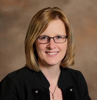 Dove Healthcare – West Eau Claire, Nursing Home in Eau Claire, WI — Professional portrait of a woman with glasses
