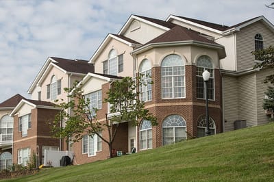 Exterior view of a multi-story retirement community building
