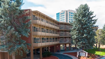 Exterior view of the facility building with trees