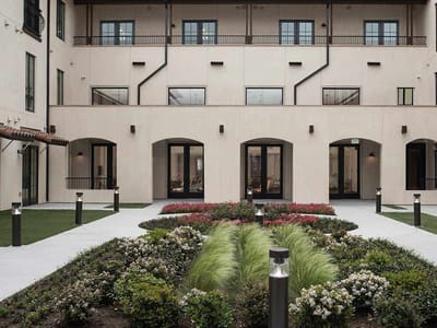 Outdoor courtyard with landscaped gardens and seating