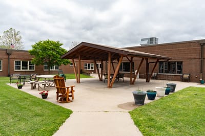 Outdoor patio area with seating and planters