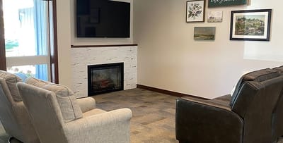 Cozy common area with seating and a fireplace
