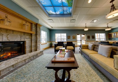 Interior common area with a cozy fireplace and seating