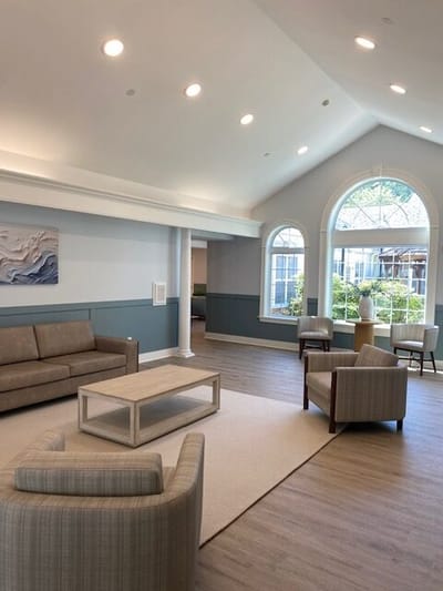 Bright common area with comfortable seating and natural light