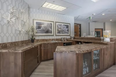 Reception area with modern decor and a marble counter