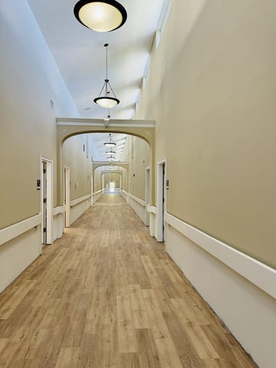 A well-lit hallway in the assisted living facility