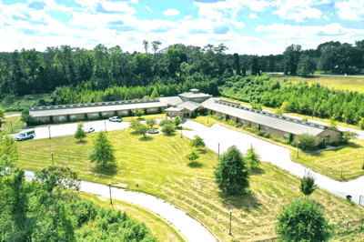 Aerial view of the assisted living facility with landscaped grounds